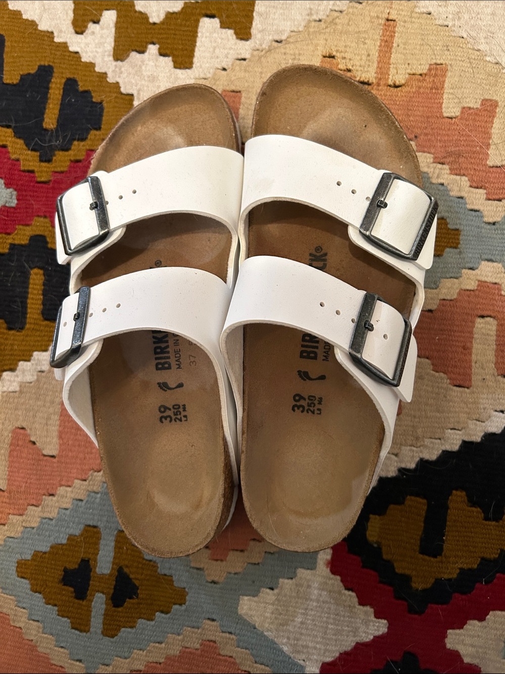 Birkenstock women’s white sandals.